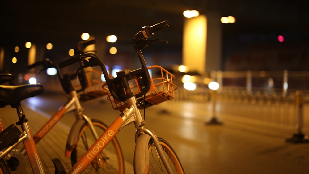 black city bike on road during night time