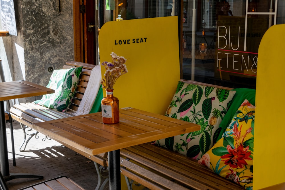 brown wooden table with yellow and white signage