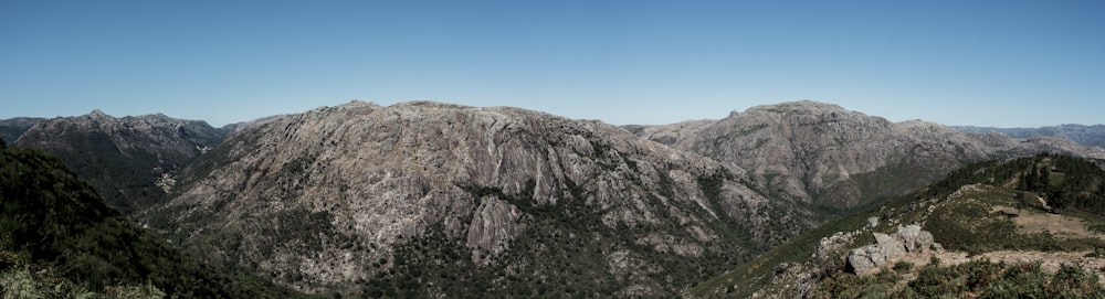 brown rocky mountain under blue sky during daytime