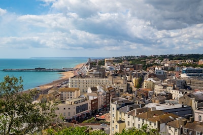 aerial view of city buildings near sea during daytime
