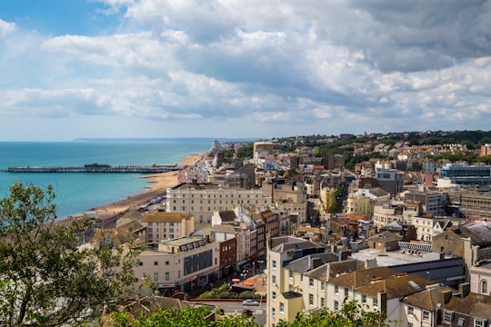 aerial view of city buildings near sea during daytime in Hastings United Kingdom