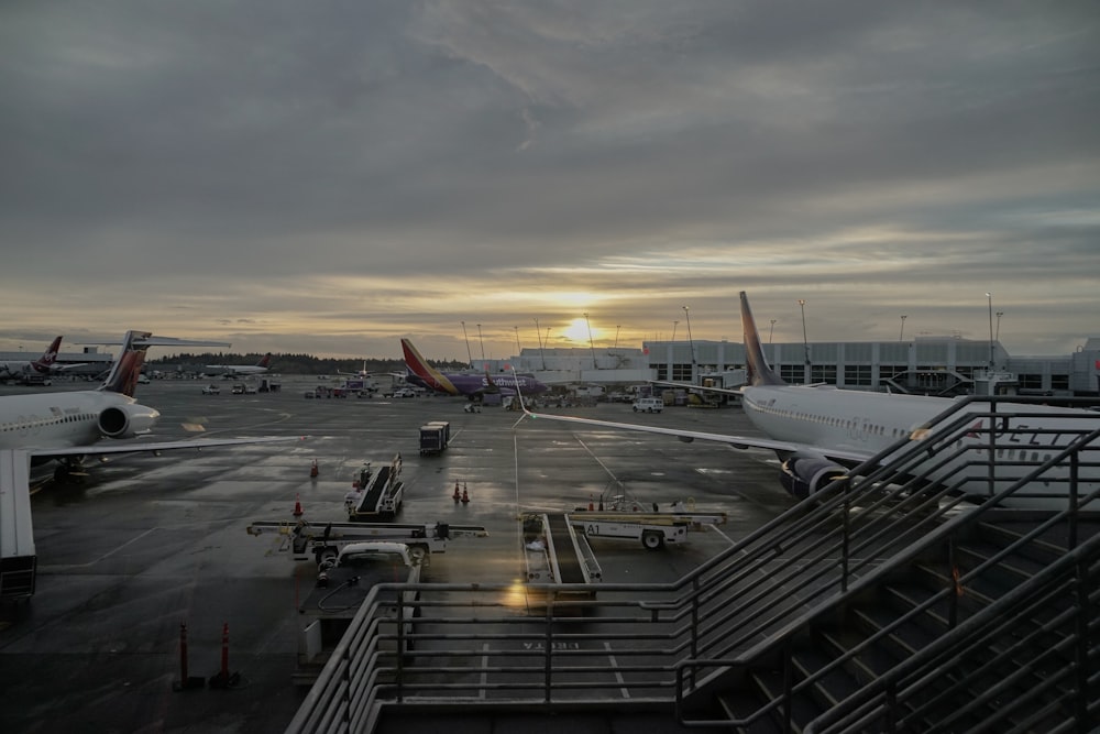 white passenger plane on dock during daytime