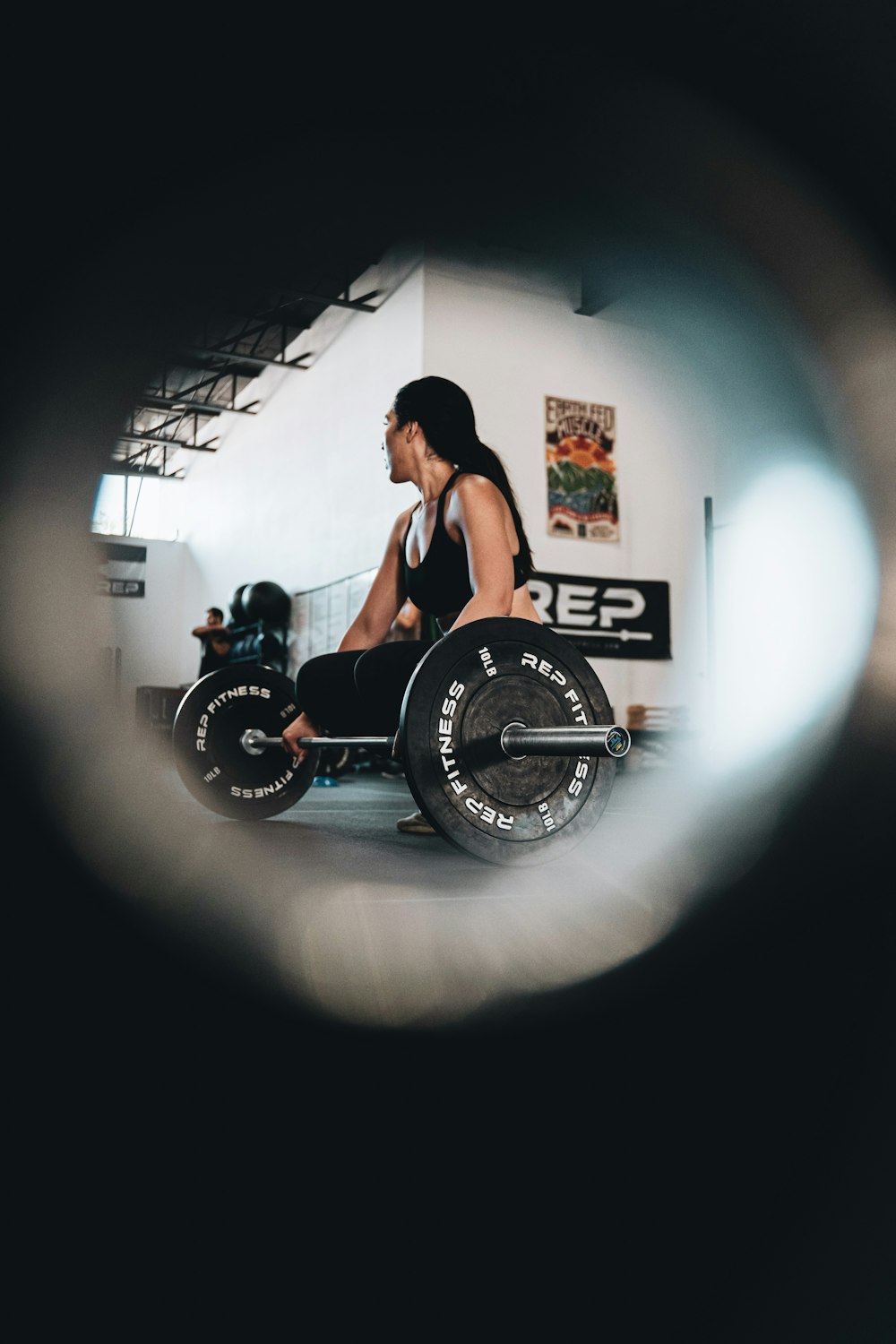 woman in black tank top sitting on black and silver wheel chair