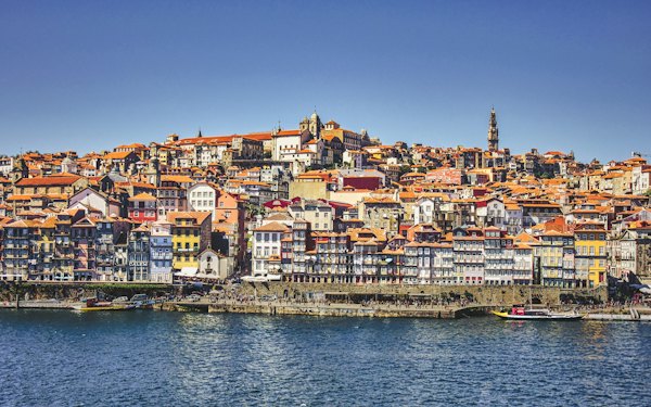 City buildings near body of water during daytime — Porto, Portugal