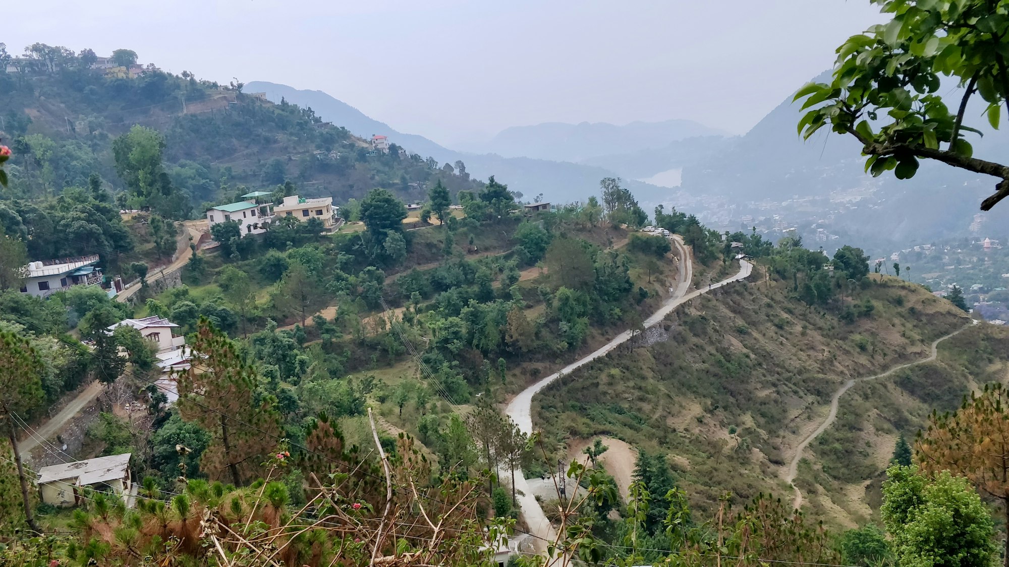 What a beautiful hike in a hill station in India Uttarakhand . Had gone for a jog up the hills and noticed this amazing view with a perfect forked road. I wish I had a better camera to capture the whole glory