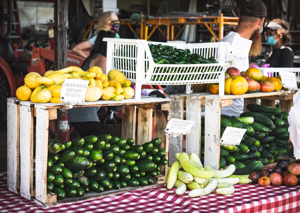 Various vegetables on display at a farm stand