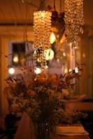 A cozy gathering space adorned with floral arrangements and soft lighting.