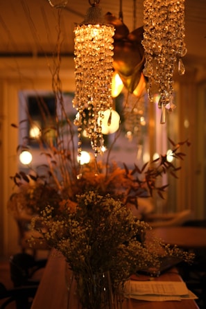 A cozy gathering space adorned with floral arrangements and soft lighting.