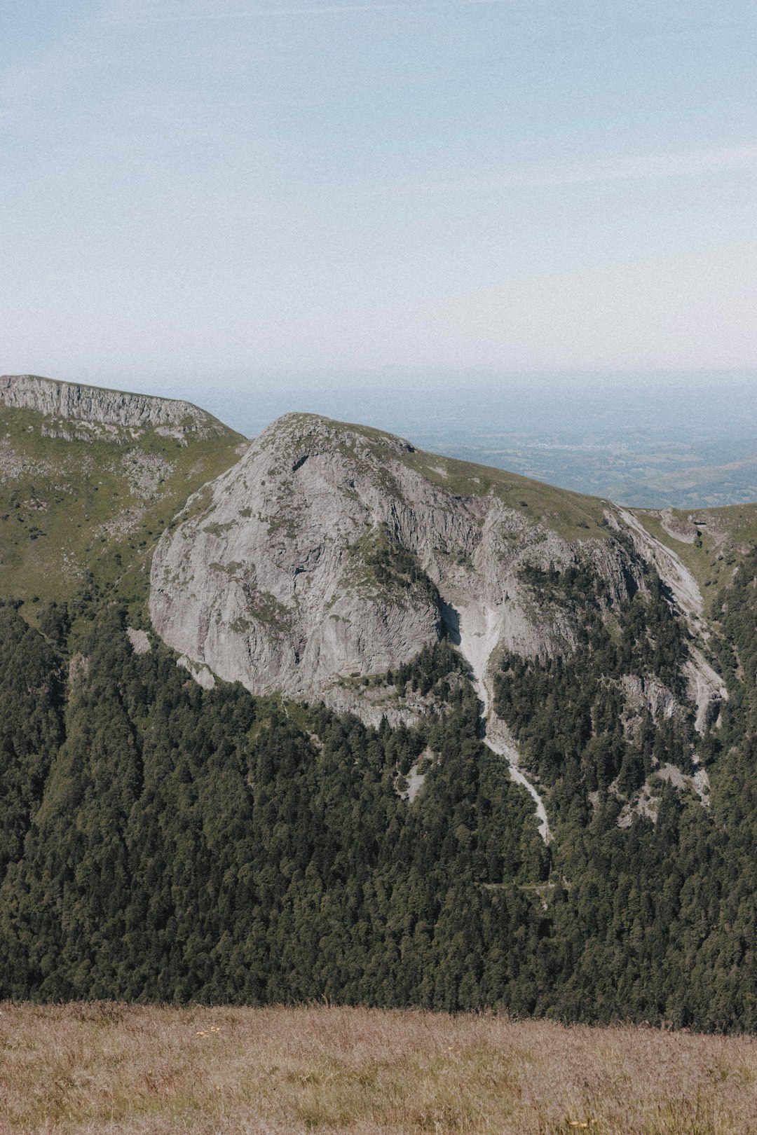 gray and green mountain under blue sky during daytime