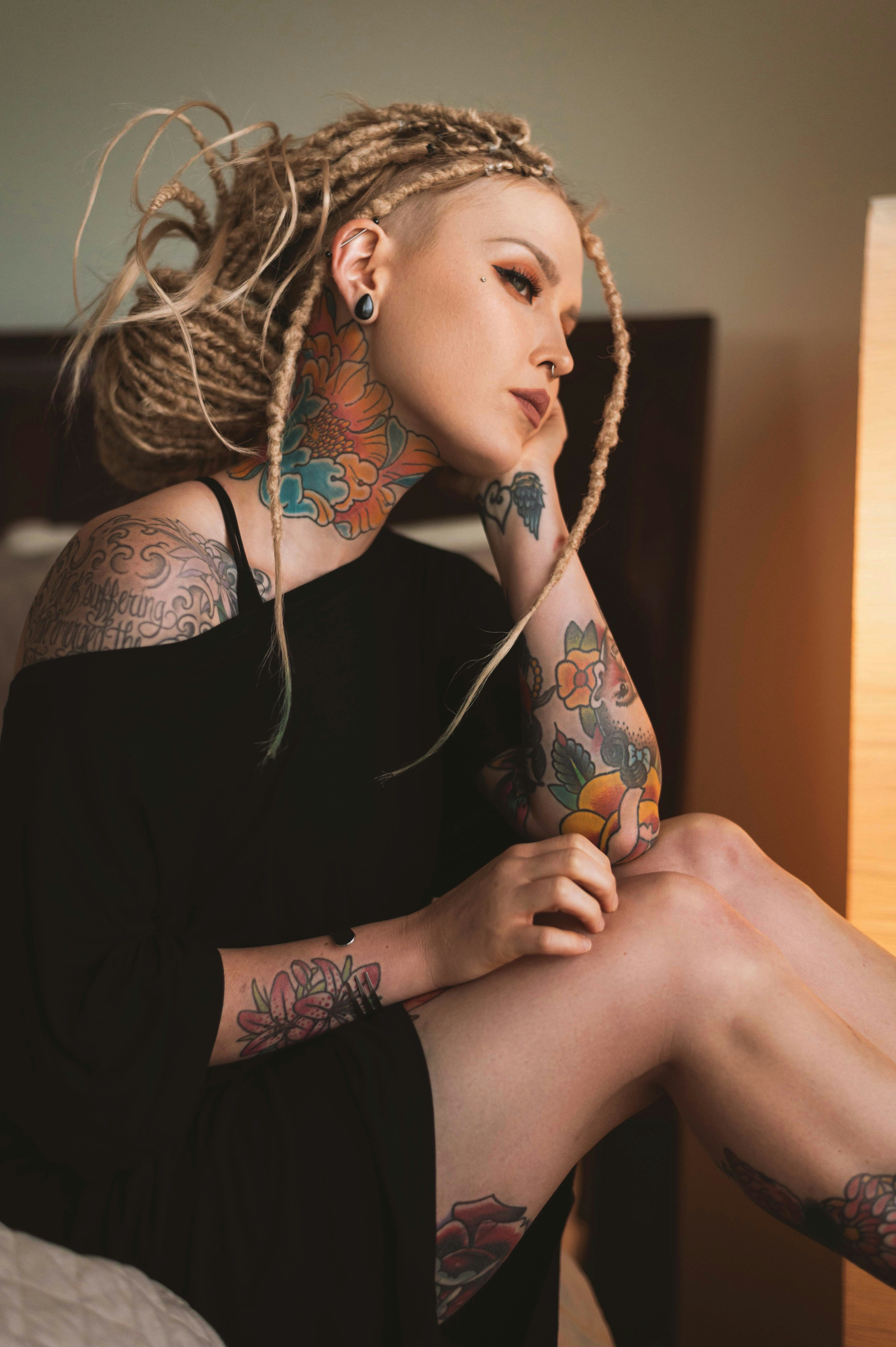 woman in black shirt wearing white earbuds