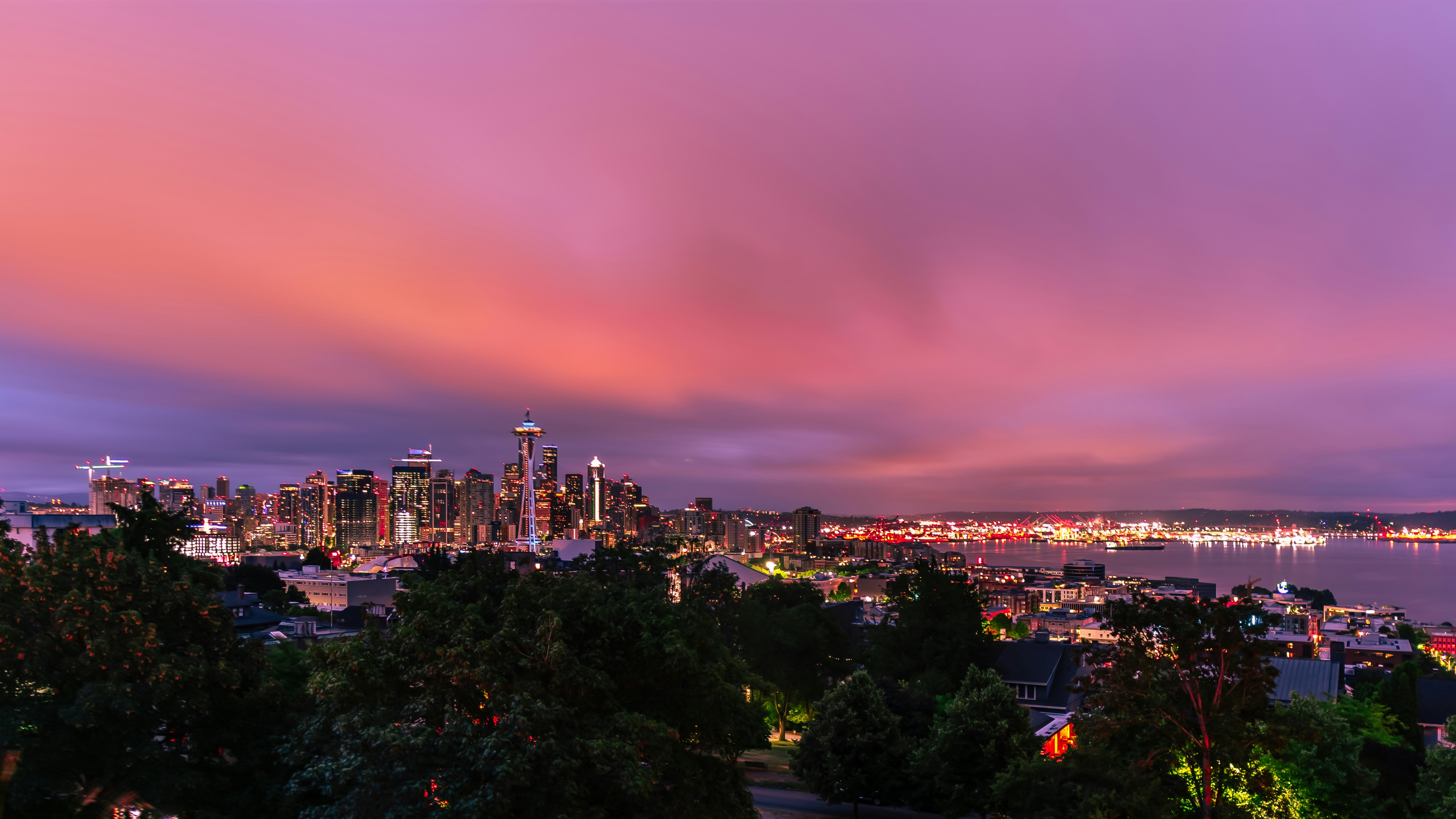 city with high rise buildings during night time