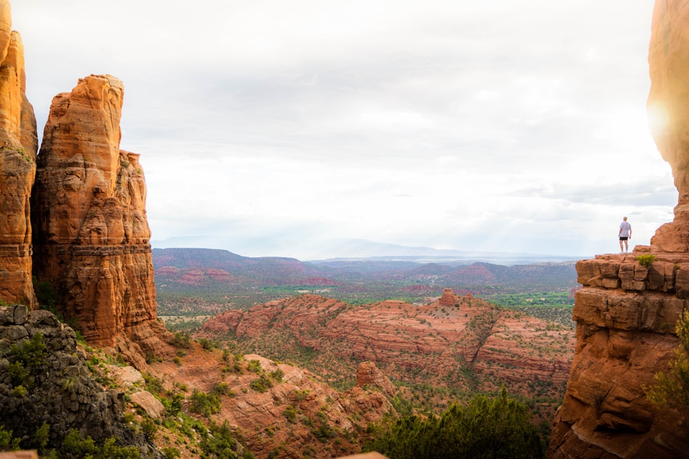 brown rock formation under white clouds during daytime