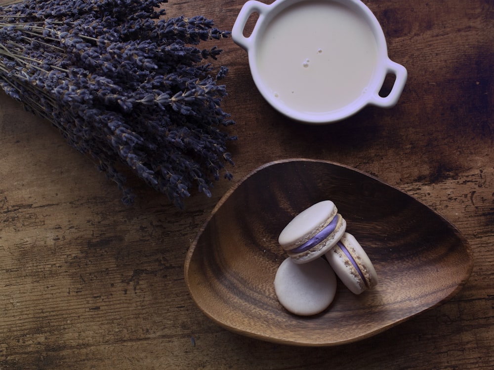 white ceramic mug on brown wooden round plate