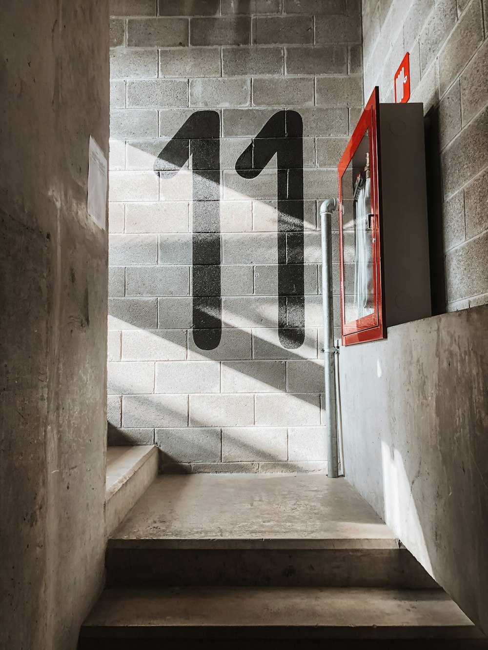 red fire extinguisher mounted on wall