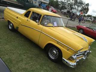 A classic car parked at a vintage event.