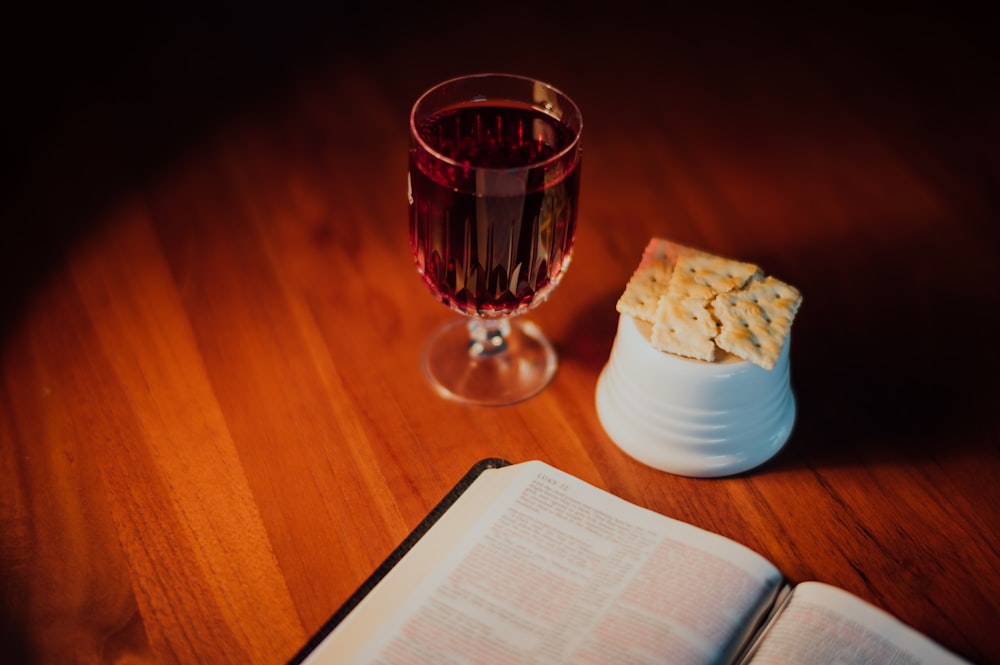 clear wine glass on brown wooden table