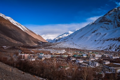 Scenic view of Tabo village in Spiti Valley, Himachal Pradesh, surrounded by rugged Himalayan peaks