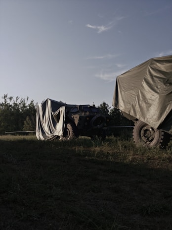 KM2A mobile security vehicle parked near an industrial site under a cloudy sky