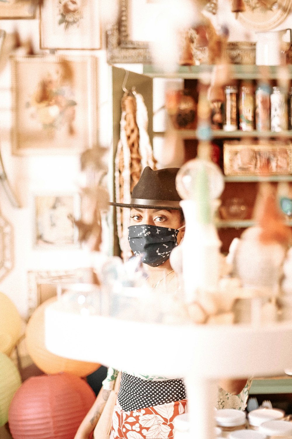 man in black sunglasses and black hat