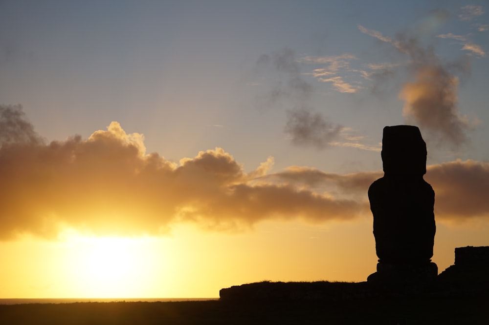 silhouette of rock formation during sunset