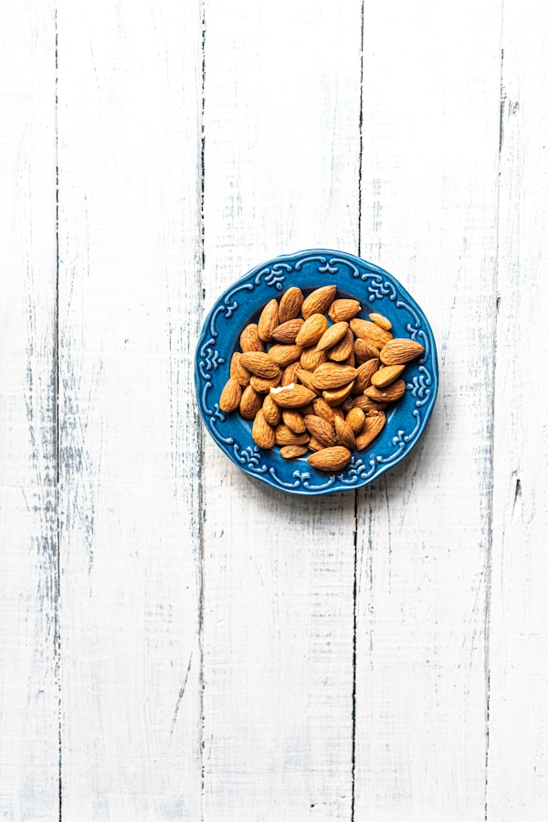 Brown nuts on blue round plate