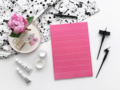 pink paper on white table