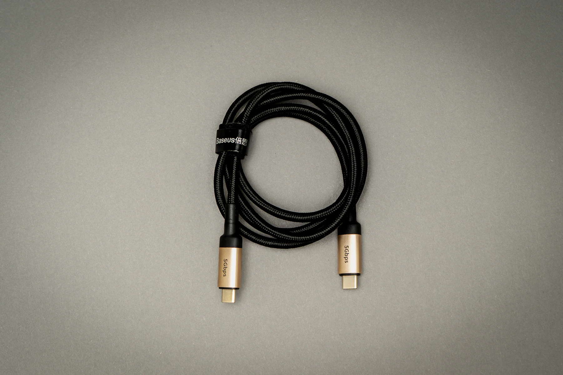 A black cable on a white table