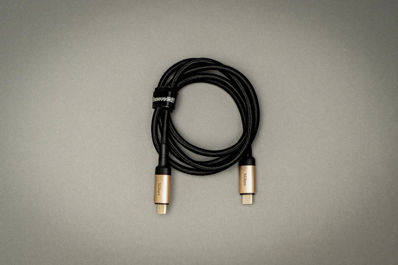 A black cable on a white table