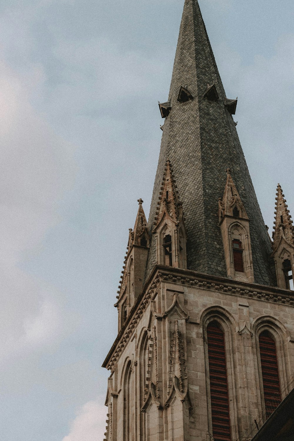 brown concrete church under white sky during daytime