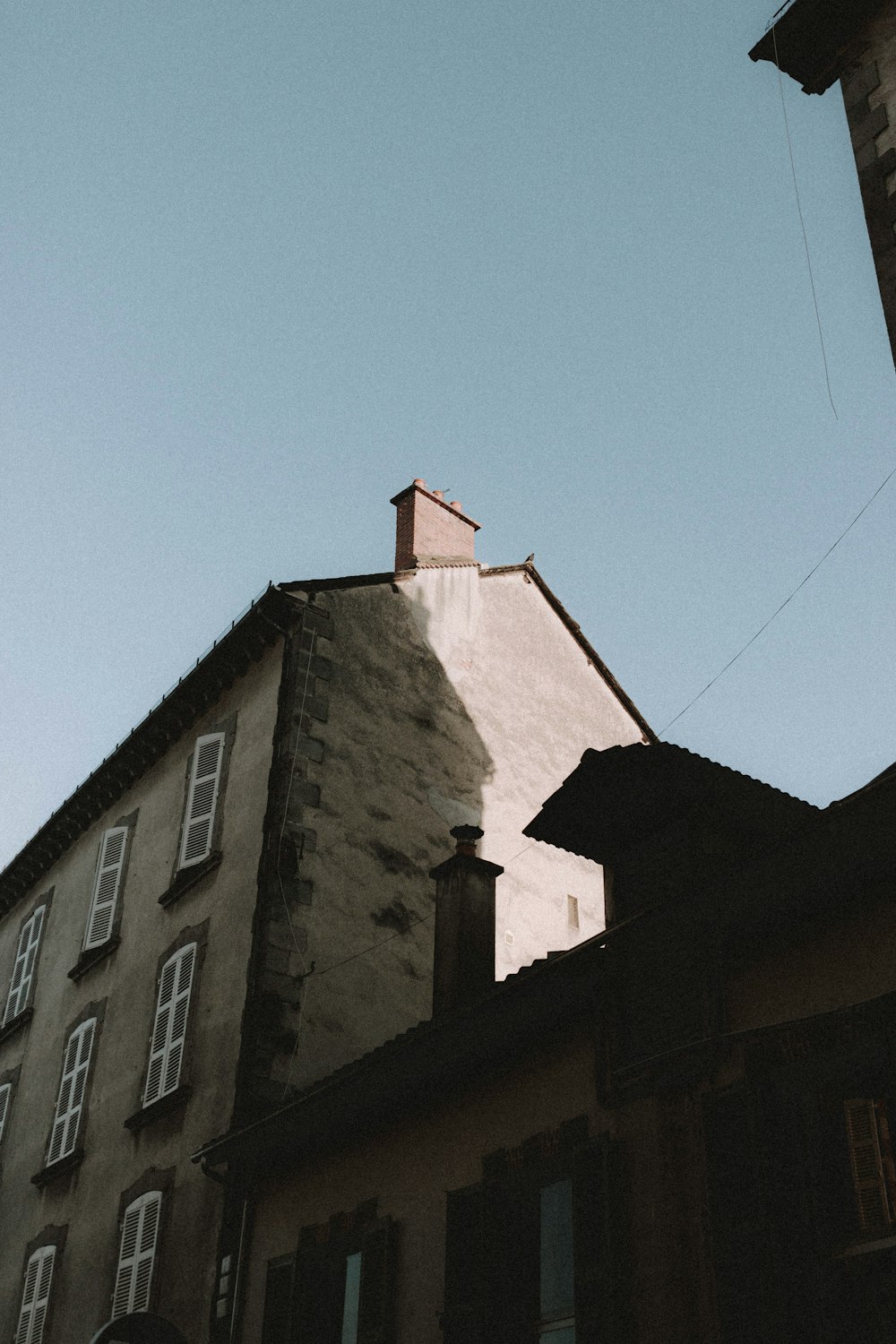 brown concrete building under blue sky during daytime