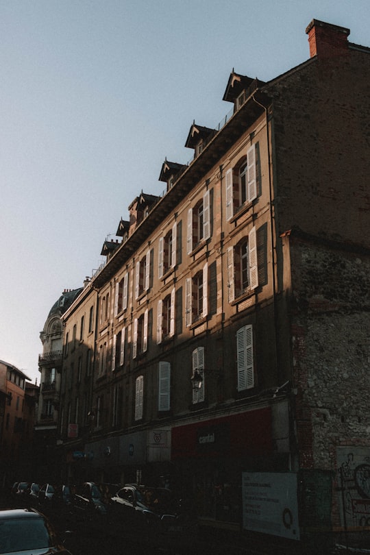 brown concrete building under blue sky during daytime in Aurillac France