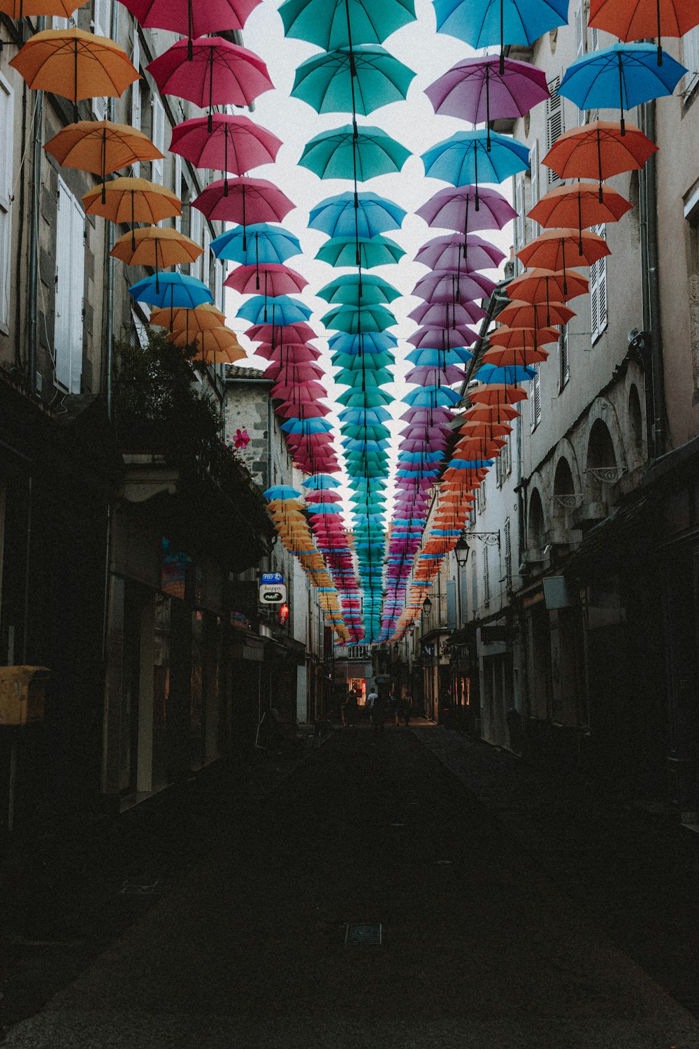 multi colored umbrella on street during daytime