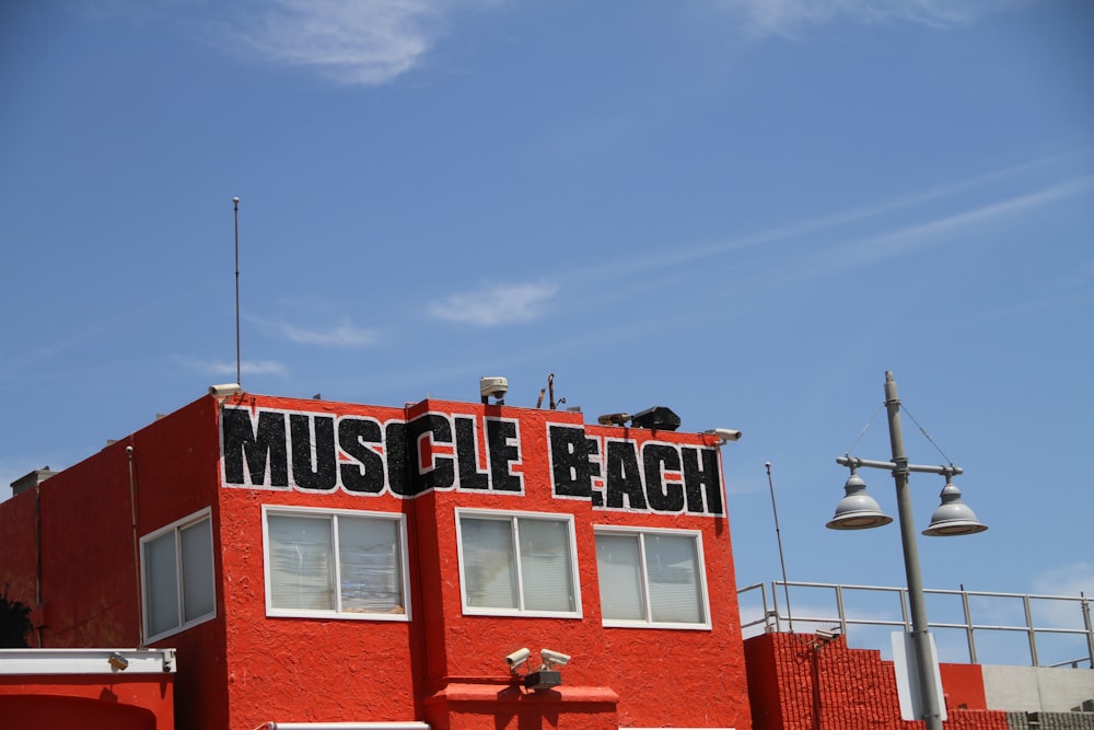 red and white concrete building under blue sky during daytime