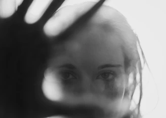 A teaser preview showing a close-up of Pauline Pastel’s hand gently resting on her face, in soft monochrome tones.