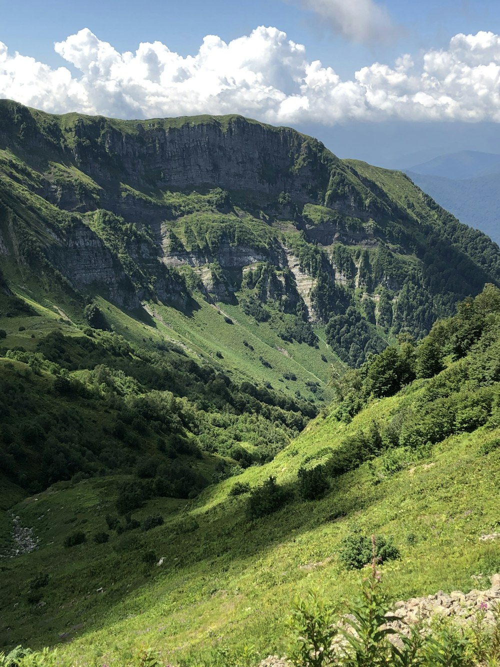 green and gray mountains under white sky during daytime