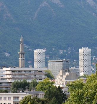 white concrete building near green trees during daytime