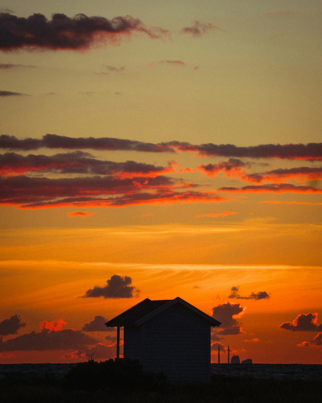 silhouette of house during sunset