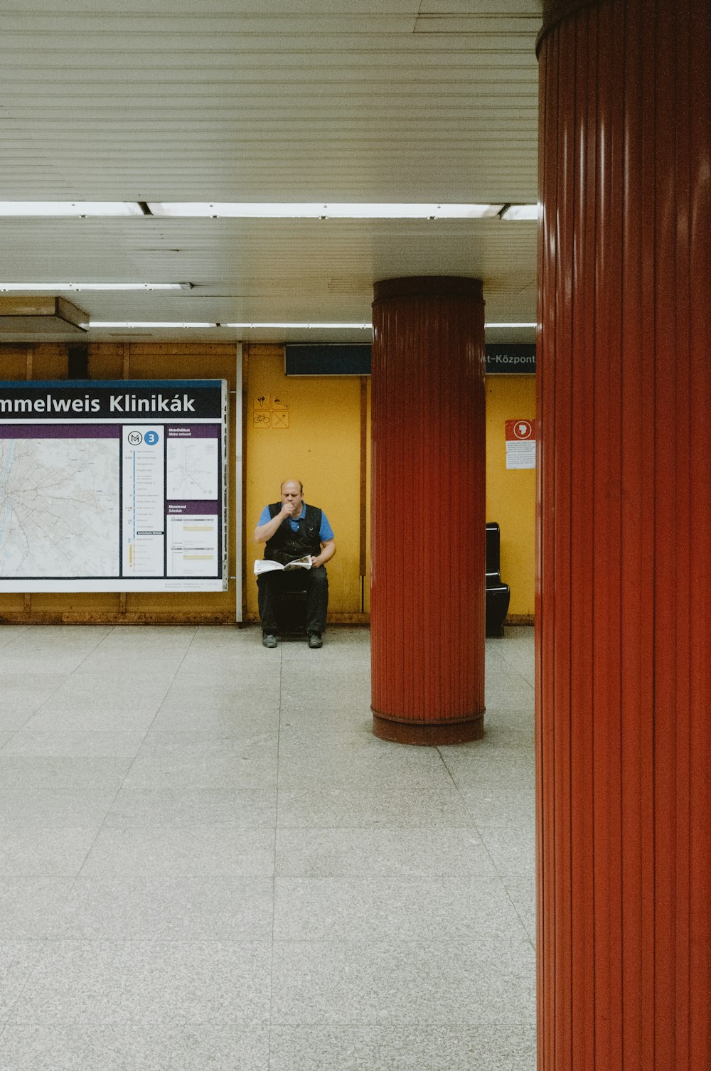 man in black jacket sitting on black chair