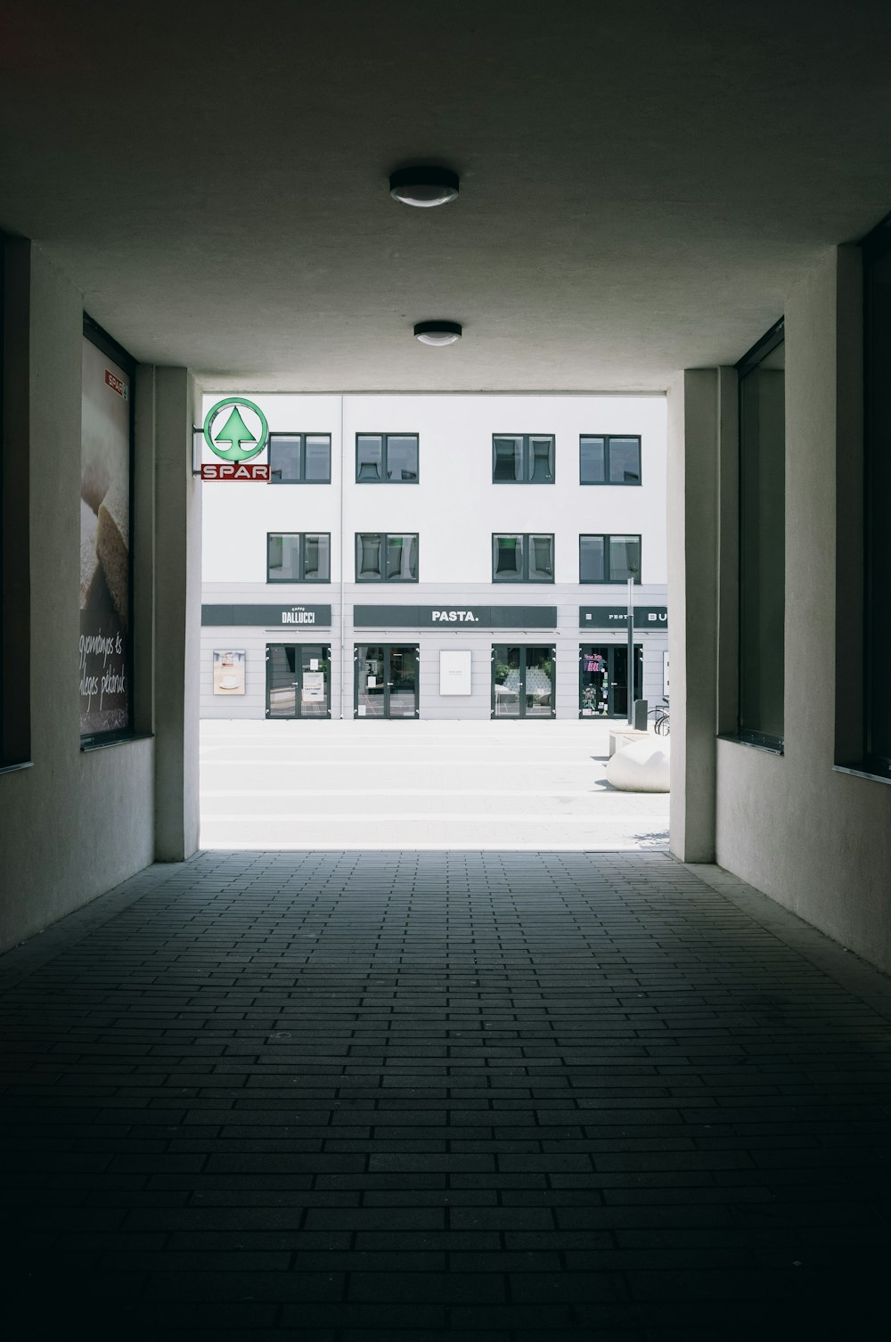 white concrete building with glass windows