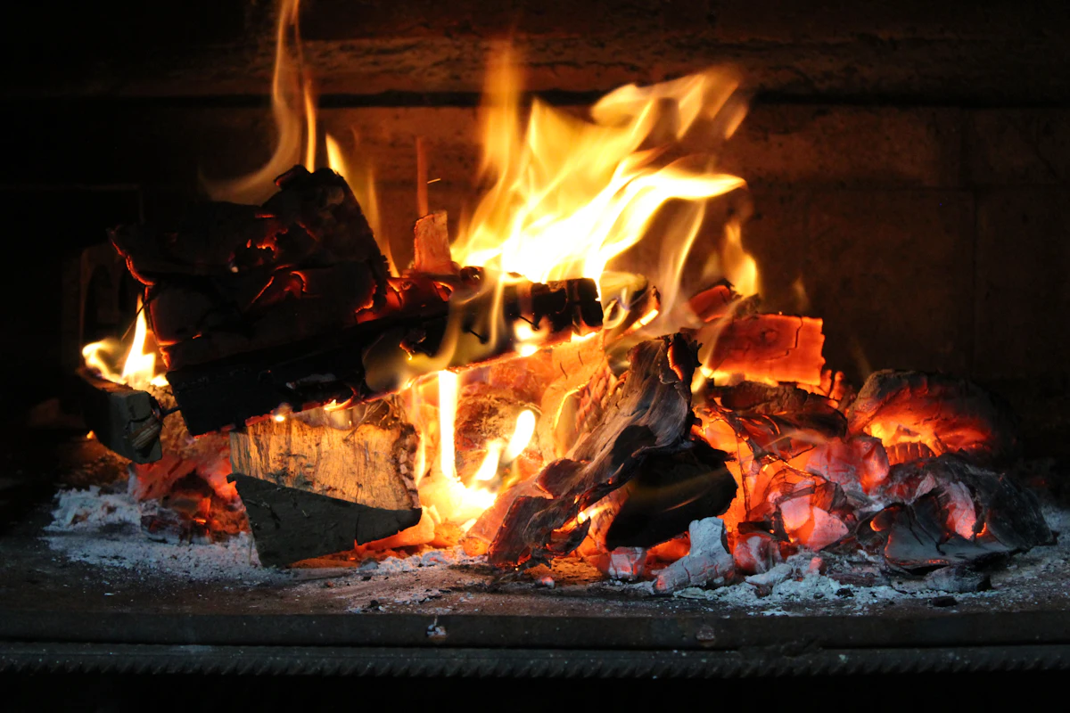Glowing wood fire and embers in a clean, well-drafting fireplace