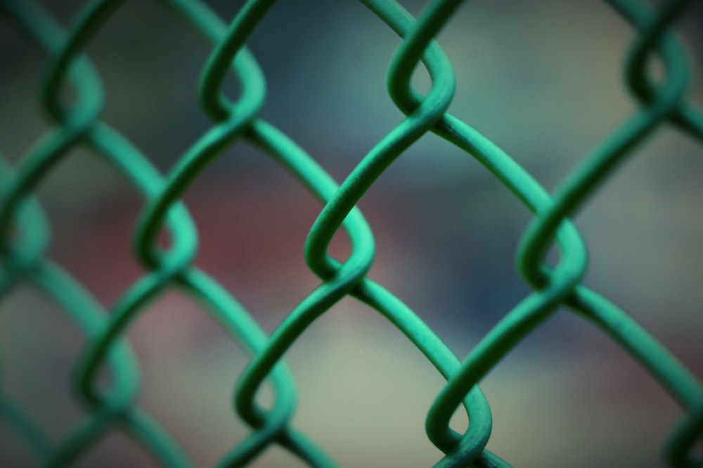 blue metal fence in close up photography