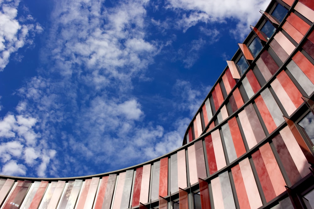 red and white concrete building under blue sky