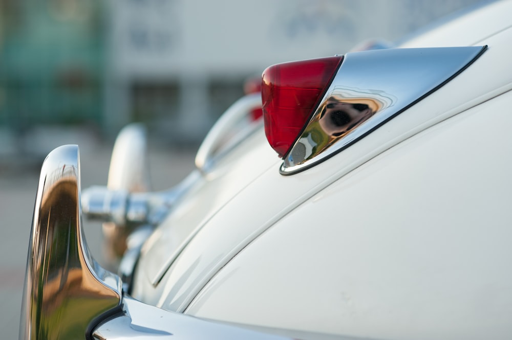 white car with red and silver door handle