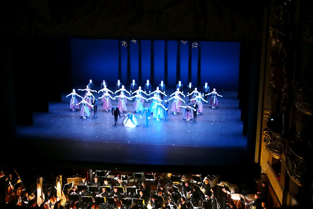 people sitting on chair on stage