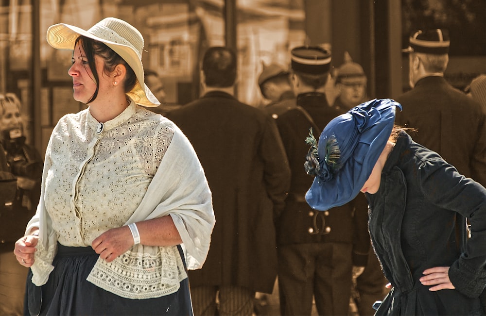 woman in white floral lace shirt and white hat