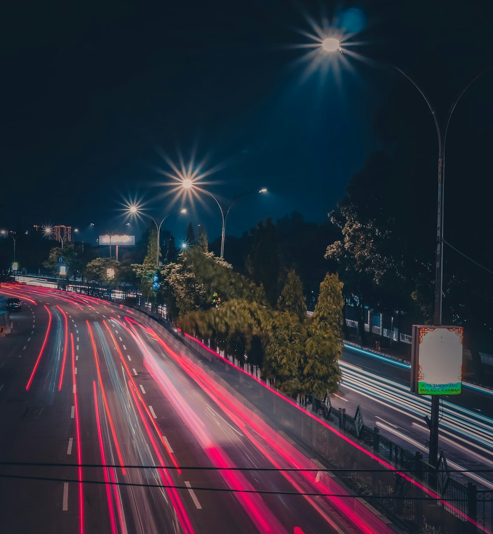 time lapse photography of cars on road during night time