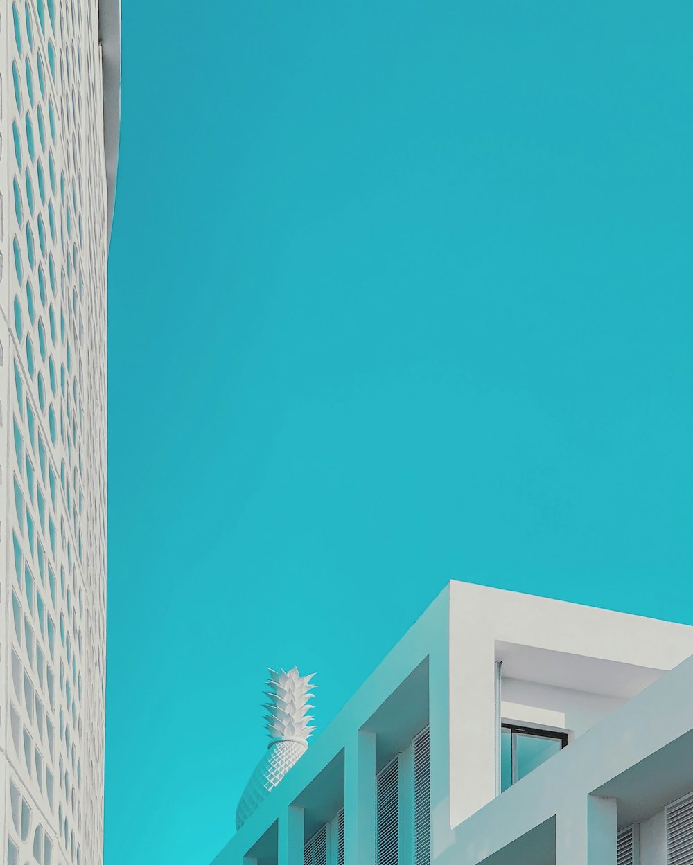 white concrete building under blue sky during daytime