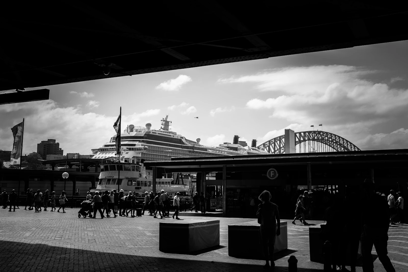 Black and white photograph of people walking on a Sydney city street