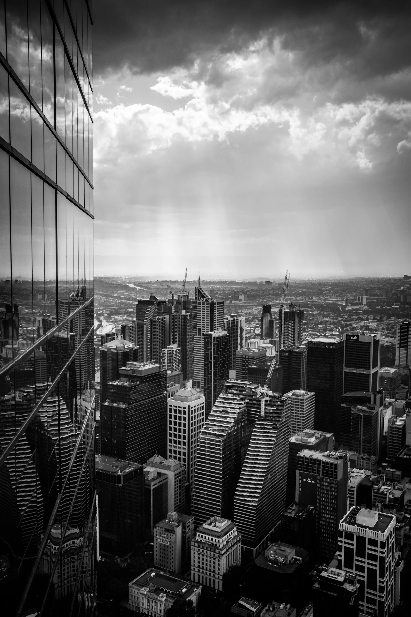 Melbourne towers rising in misty monochrome light