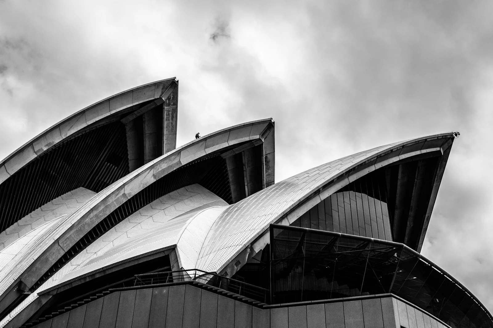 Black and white photo of a Sydney office building under a cloudy sky